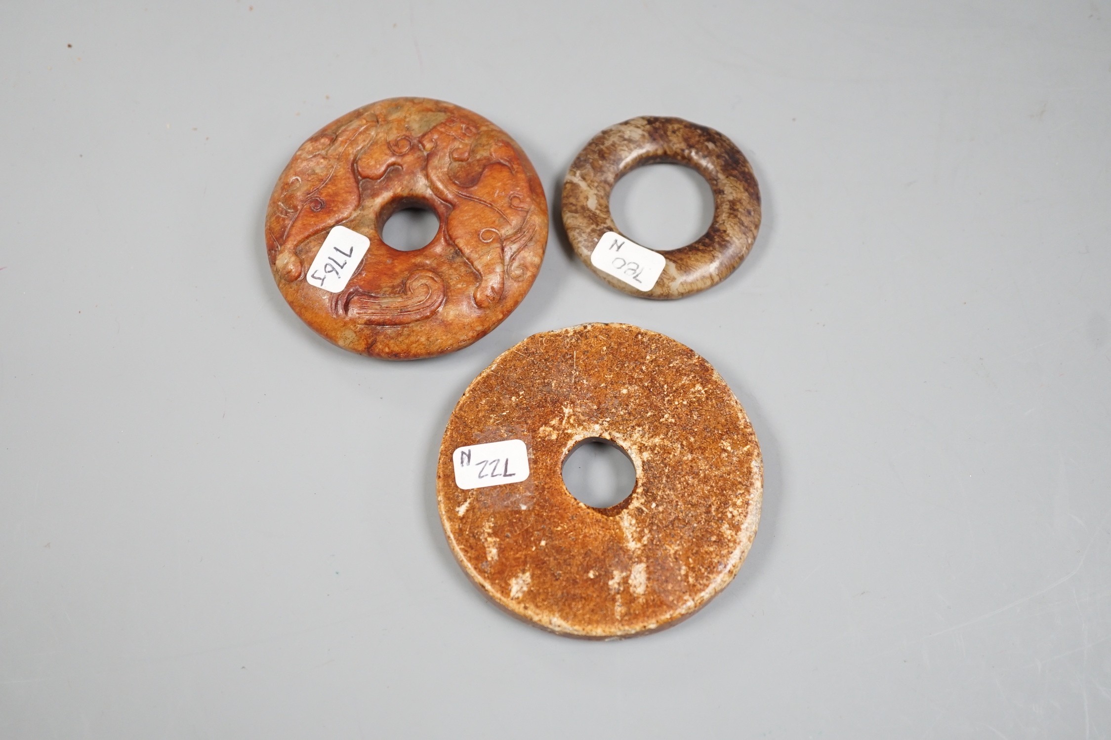 Three Chinese jade or hardstone roundels